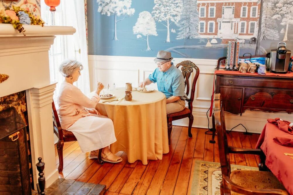 A couple enjoying breakfast in our dining room at our romantic Bed and Breakfast in Kentucky