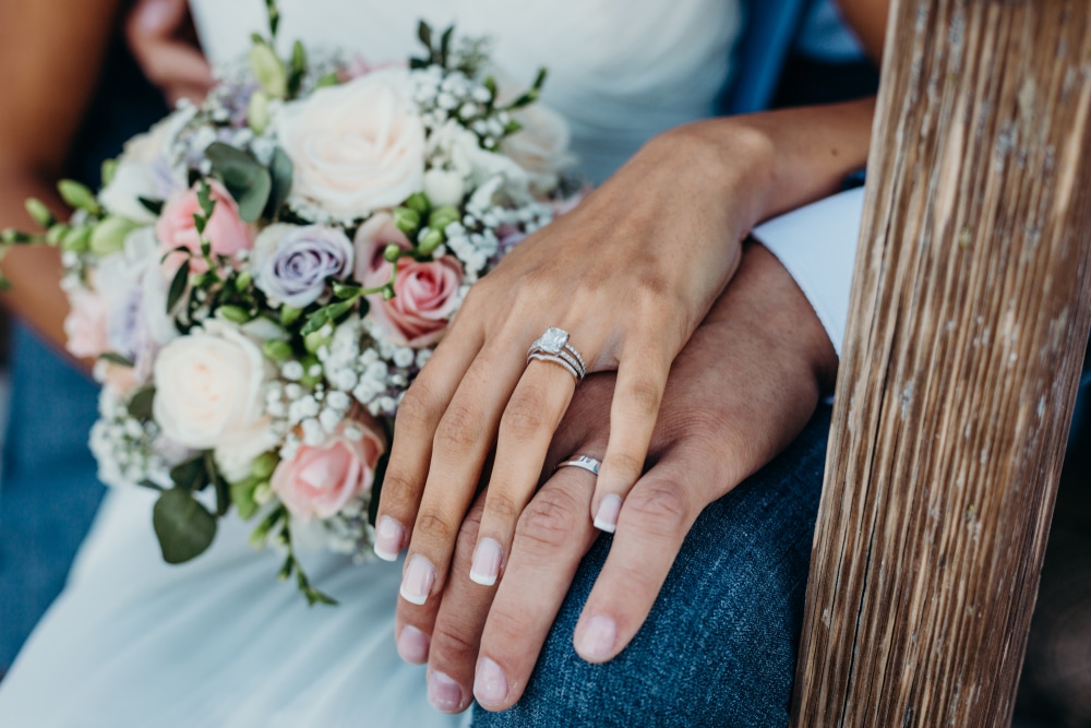 A couple showing their rings after eloping in Kentucky