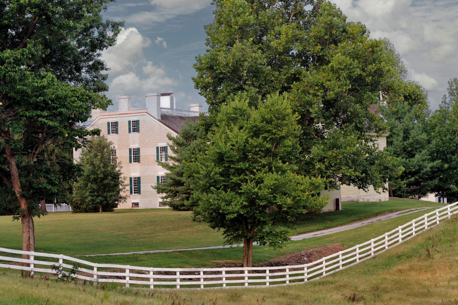 White fence, house at Shaker Village at Pleasant Hill.