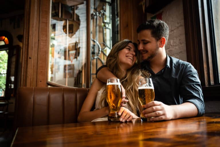 Young couple enjoying beer and other fun things to do in Kentucky for couples during romantic getaways in Kentucky