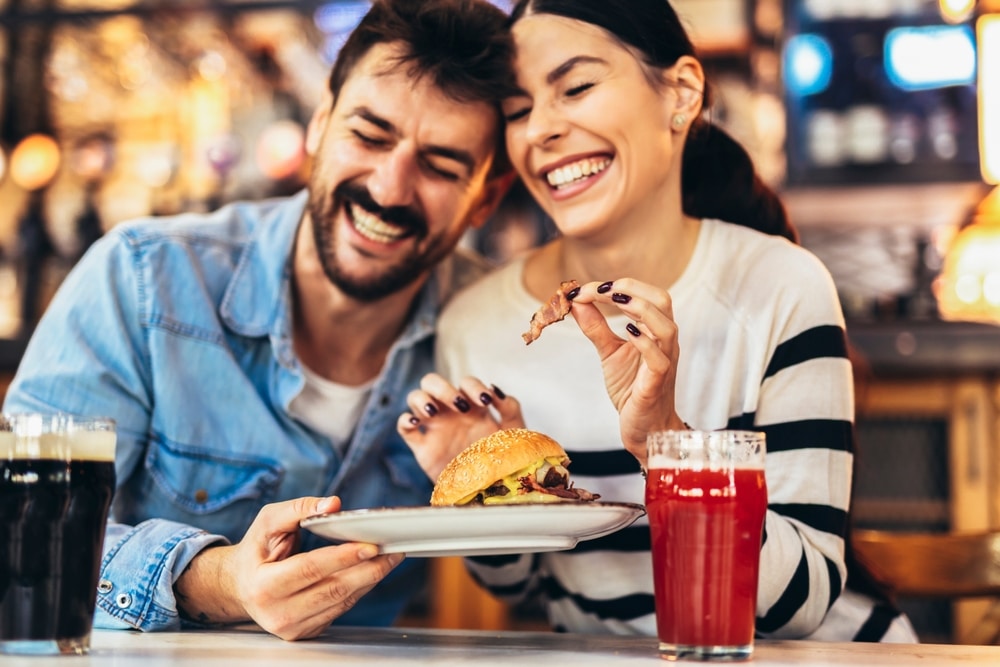 Couple enjoying a meal during their romantic getaway at the top Danville, KY Restaurants