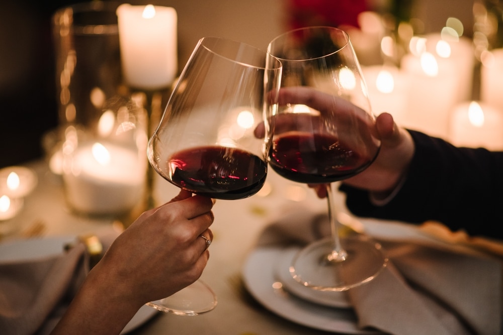 Couple with glasses of red wine at Danville, KY Restaurants